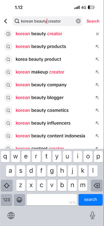 Using specific keywords in TikTok search bar to find someone